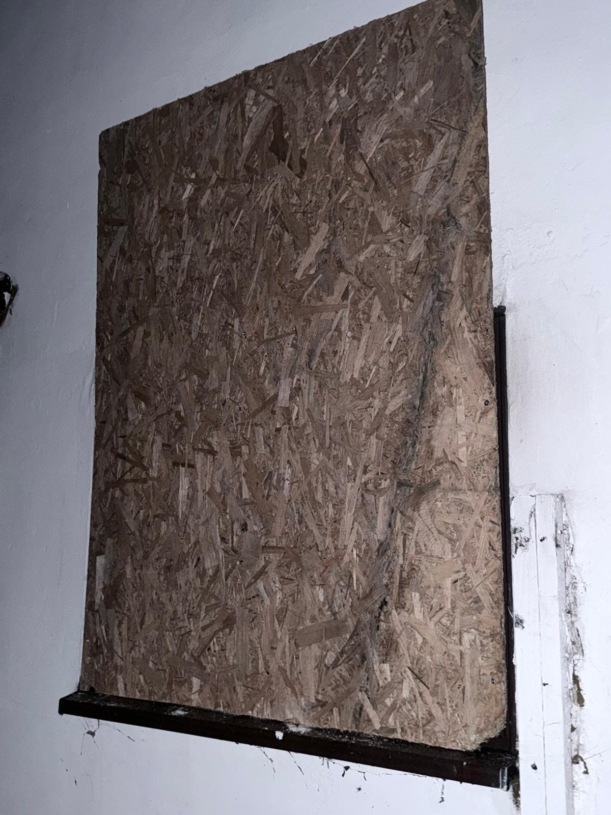 Doorway boarded up to make a property safe